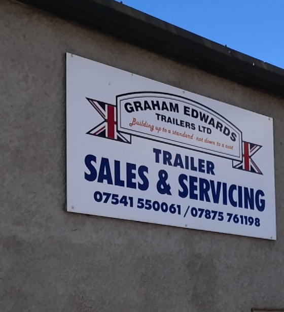 The Graham Edwards Trailers sales and servicing board on the Ulverston Tyres workshop wall