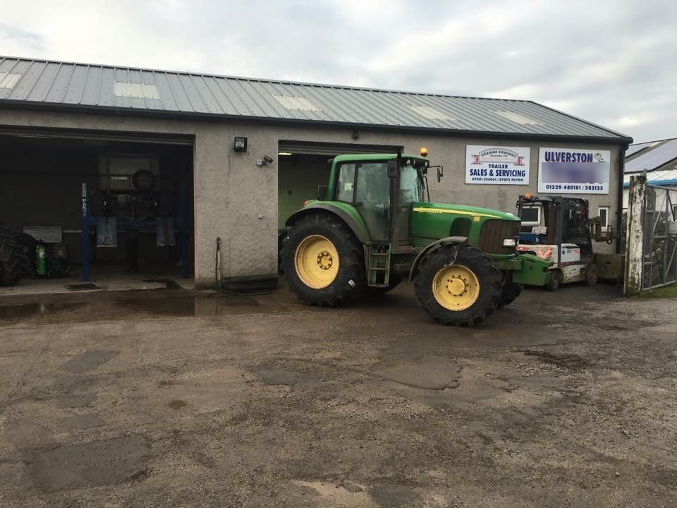 The Ulverston Tyres workshop with a John Deere tractor in for tyres