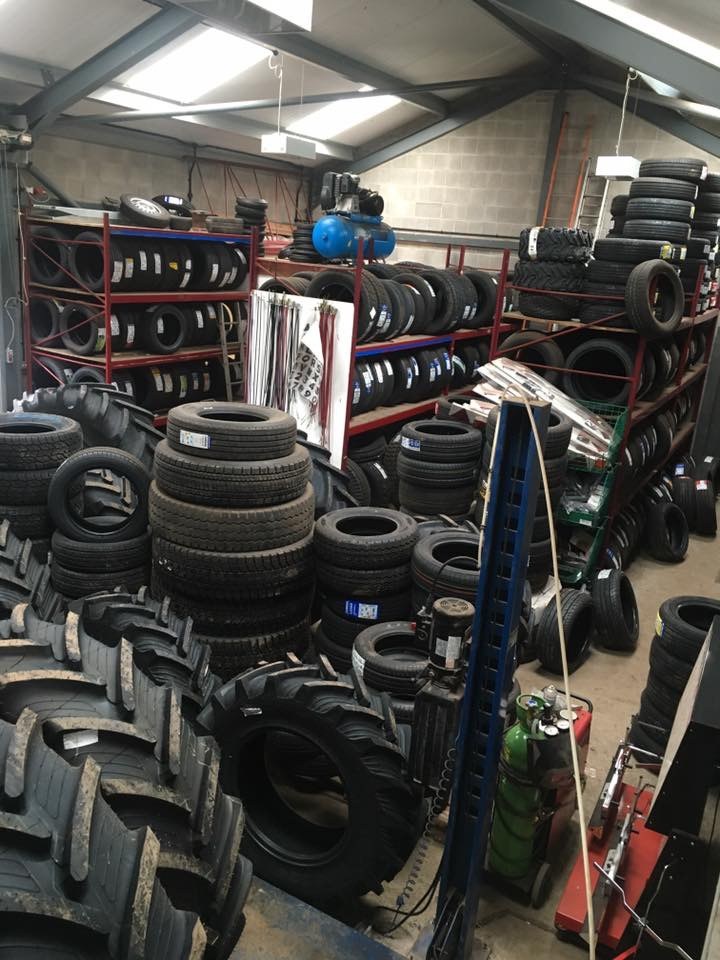 The Ulverston Tyres store: car and agricultural tyres racked floor to ceiling